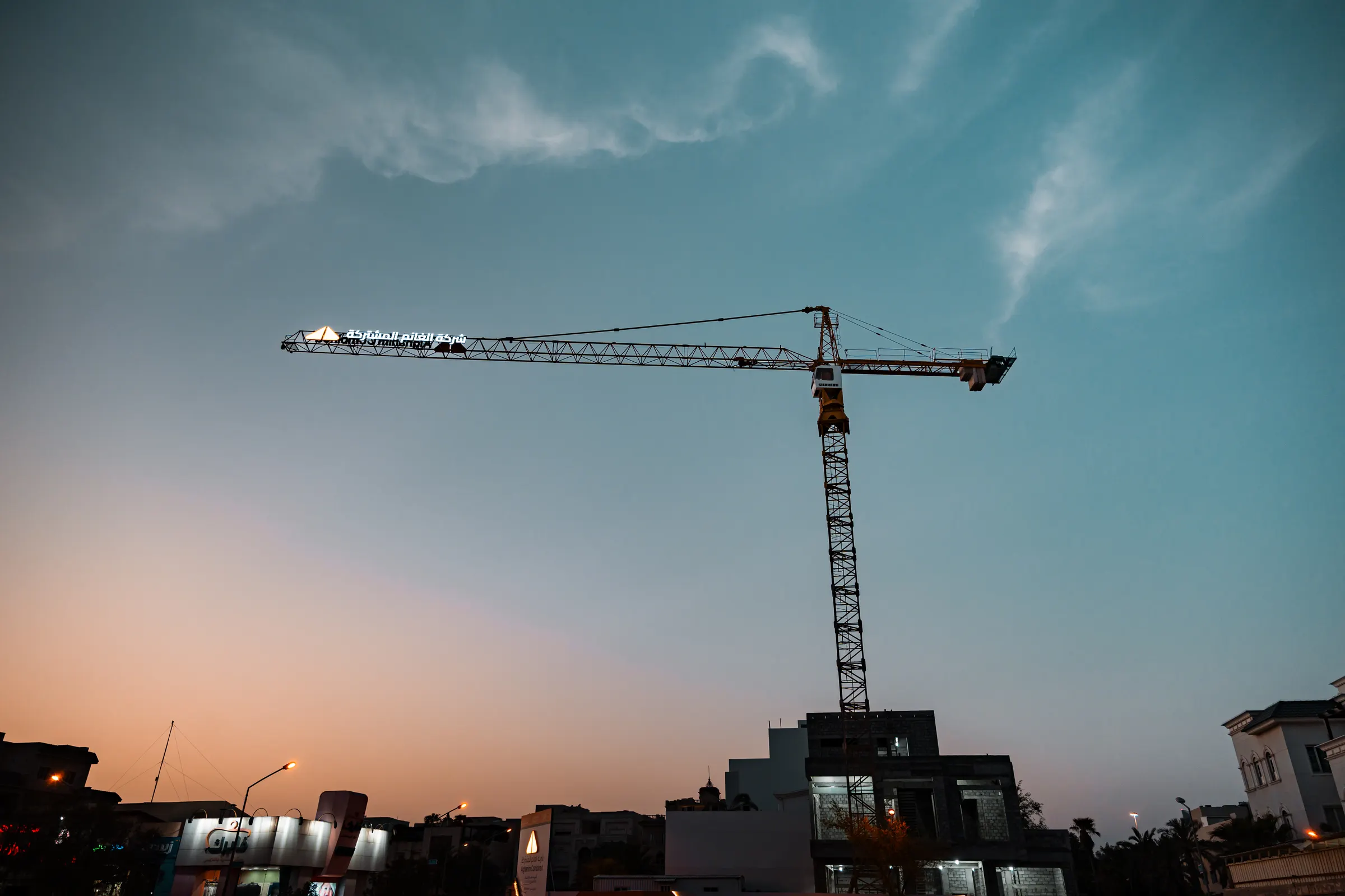Alghanim Combined tower crane against a dusk sky in Kuwait