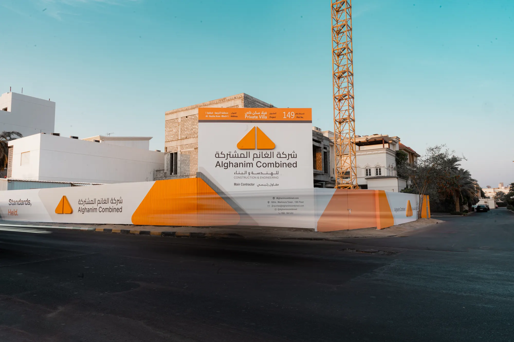 Alghanim Combined site hoarding and tower crane on a construction site in Kuwait