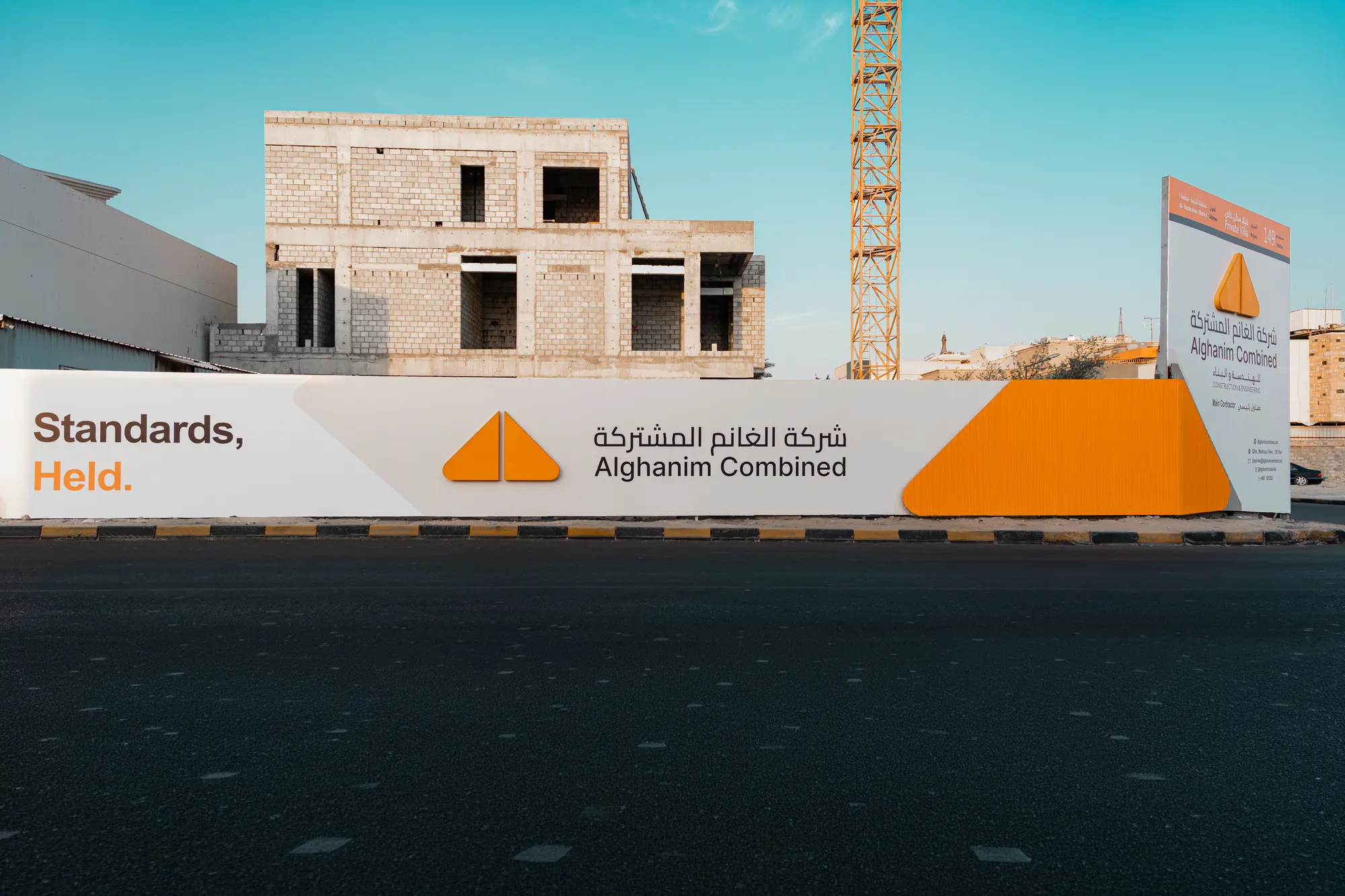 Alghanim Combined site hoarding in daylight on a construction site in Kuwait